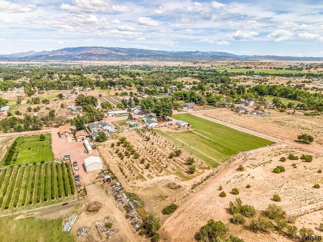 drone / aerial view with a mountain view and a rural view