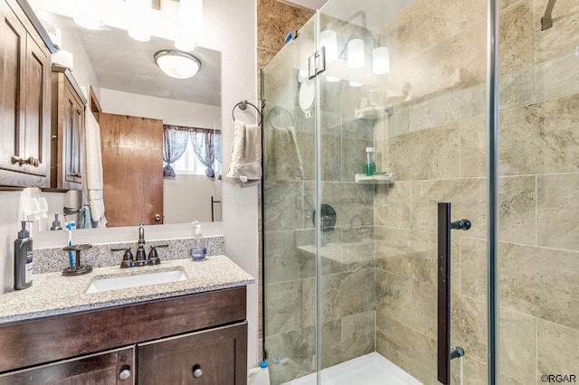 bathroom with vanity and walk in shower