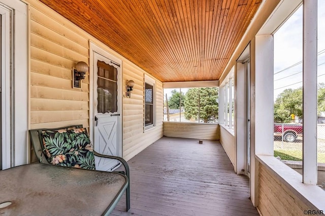 sunroom / solarium with wood ceiling