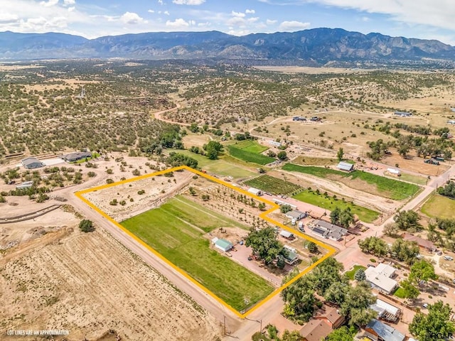 birds eye view of property with a mountain view