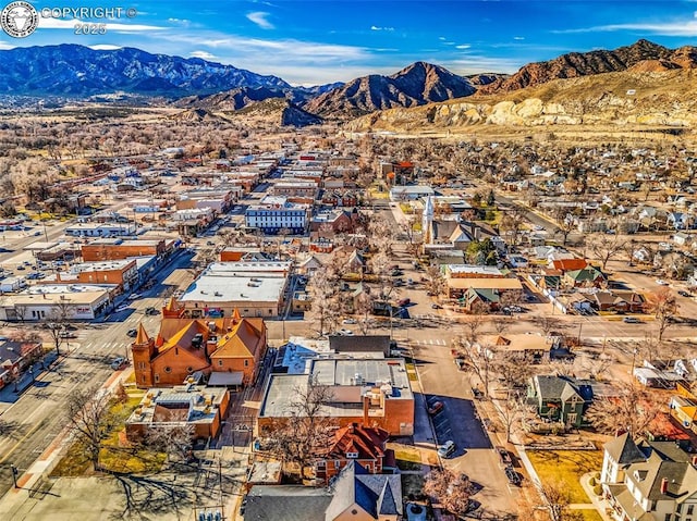 birds eye view of property featuring a mountain view