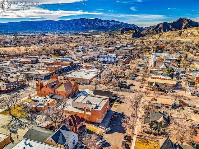 birds eye view of property with a mountain view