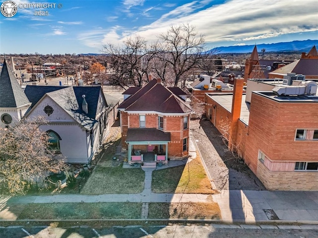 birds eye view of property featuring a mountain view