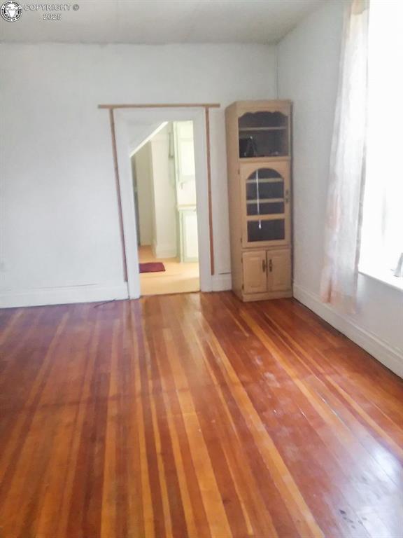 unfurnished room with light hardwood / wood-style flooring