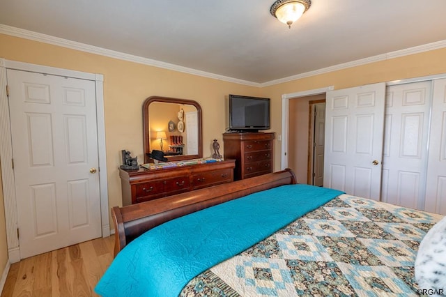 bedroom featuring ornamental molding and light hardwood / wood-style flooring