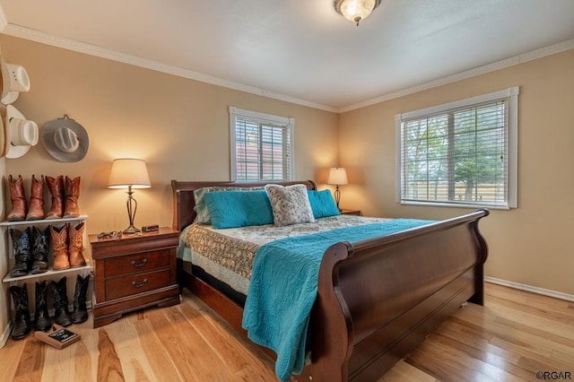 bedroom featuring crown molding and light wood-type flooring