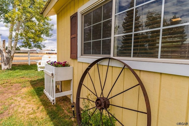 view of side of property featuring a yard