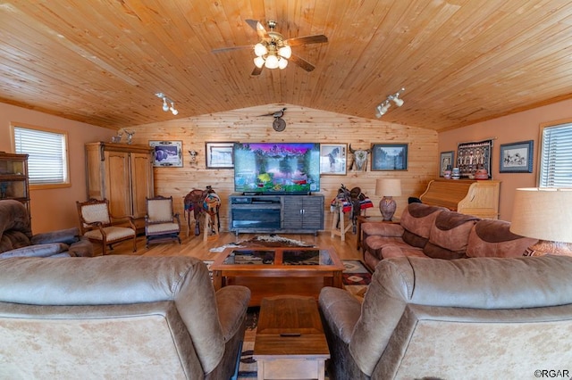 living room with lofted ceiling, wooden ceiling, light hardwood / wood-style floors, and wood walls