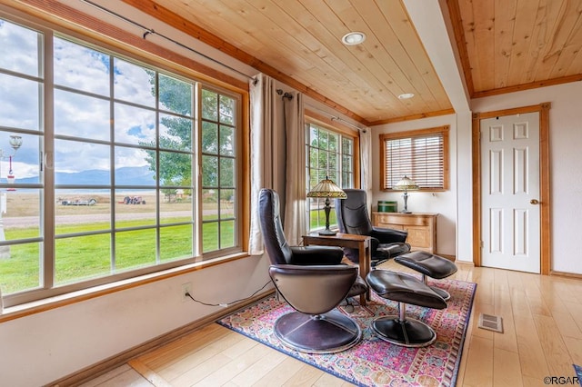 sunroom / solarium with wood ceiling and a mountain view