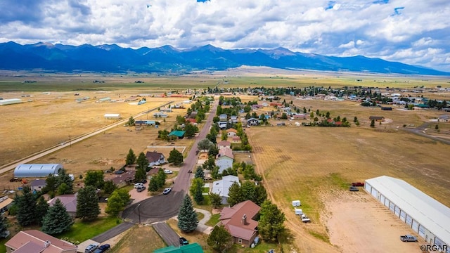 birds eye view of property featuring a mountain view