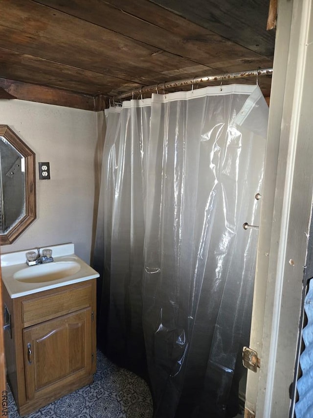 bathroom featuring vanity and wood ceiling