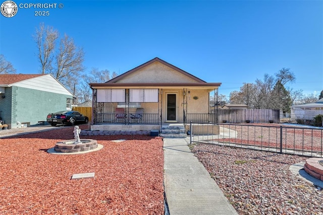1110 Euclid Ave, Pueblo, CO 81004 - bungalow featuring a porch and stucco siding