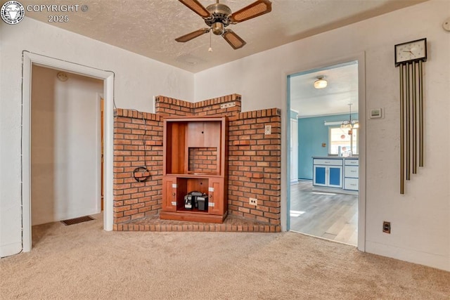 1110 Euclid Ave, Pueblo, CO 81004 - unfurnished living room with carpet floors and a ceiling fan
