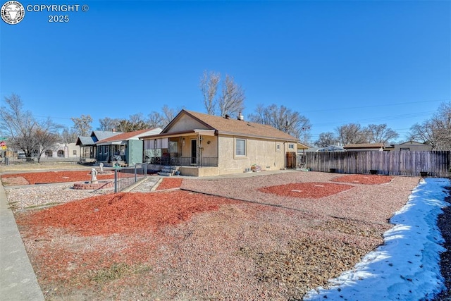 1110 Euclid Ave, Pueblo, CO 81004 - rear view of property featuring a porch and stucco siding