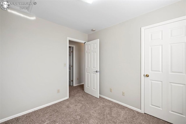 unfurnished bedroom with light colored carpet