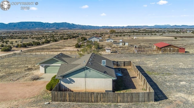 birds eye view of property with a mountain view