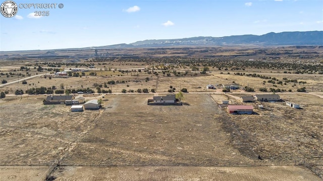 aerial view featuring a rural view and a mountain view