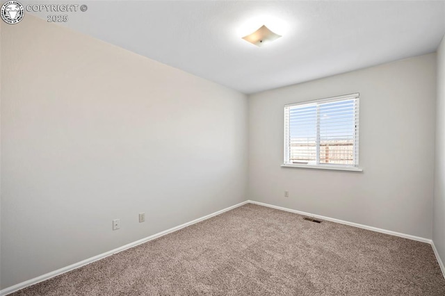 unfurnished room with carpet flooring