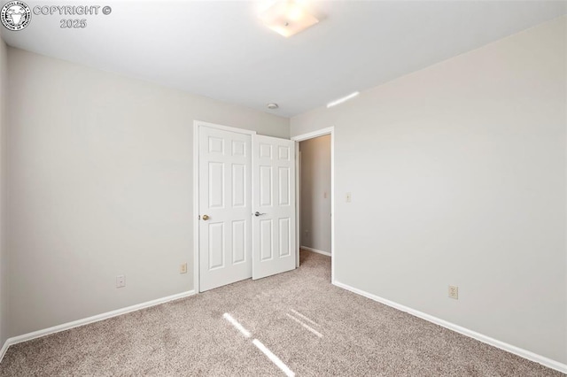 unfurnished bedroom with carpet floors