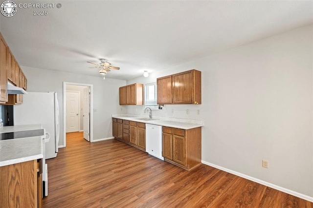 kitchen with sink, ceiling fan, range, white dishwasher, and wood-type flooring