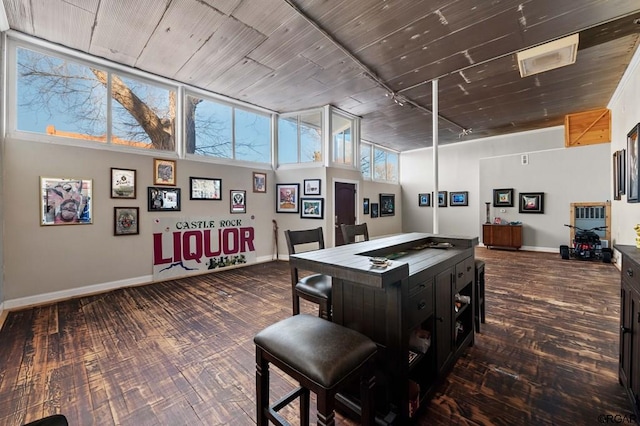 recreation room with a towering ceiling