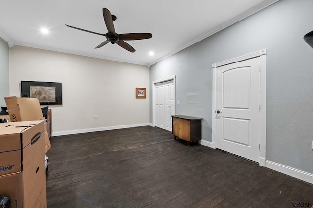 interior space featuring dark hardwood / wood-style flooring, ornamental molding, a closet, and ceiling fan