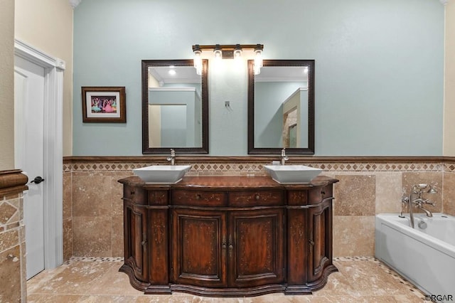 bathroom with ornamental molding, vanity, a bath, and tile walls