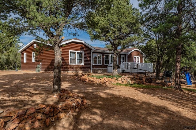 view of front of property with a wooden deck