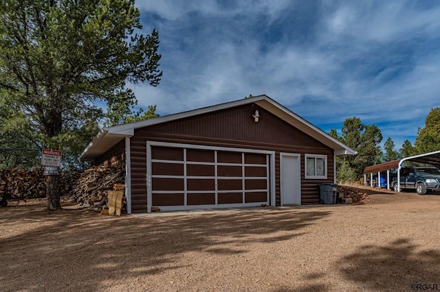 garage featuring a carport