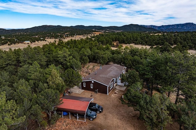 birds eye view of property with a mountain view