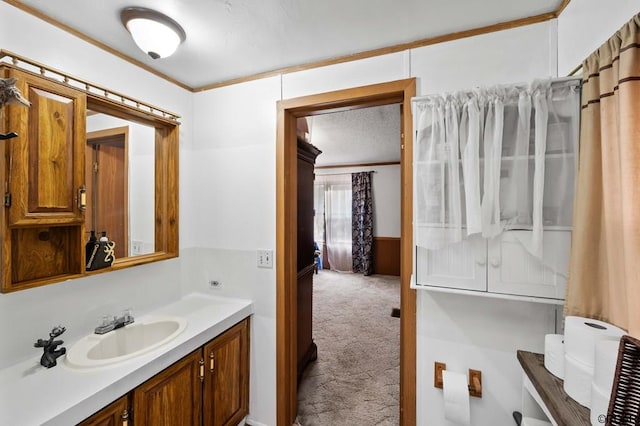 bathroom featuring vanity and ornamental molding