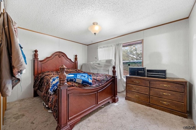 carpeted bedroom featuring ornamental molding and a textured ceiling