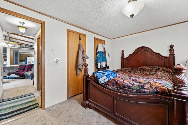 bedroom with light carpet, crown molding, and a textured ceiling