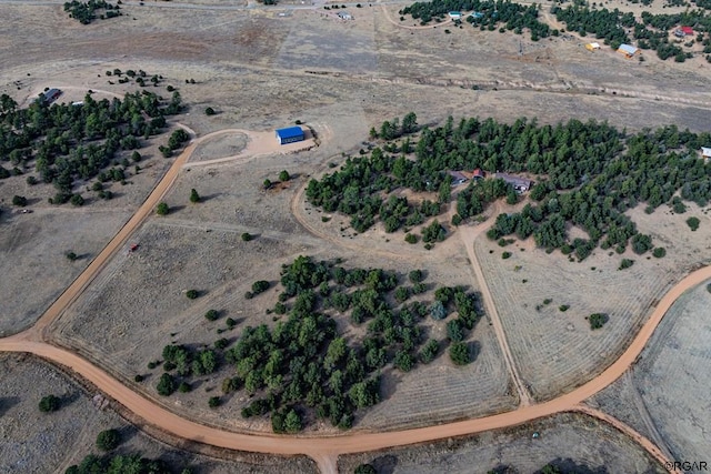 birds eye view of property with a rural view