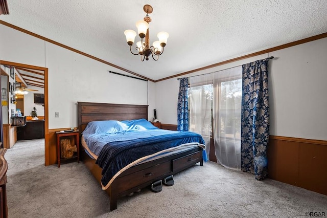 bedroom with an inviting chandelier, crown molding, light carpet, and a textured ceiling