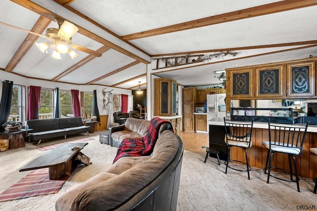 carpeted living room featuring lofted ceiling with beams, a textured ceiling, and ceiling fan