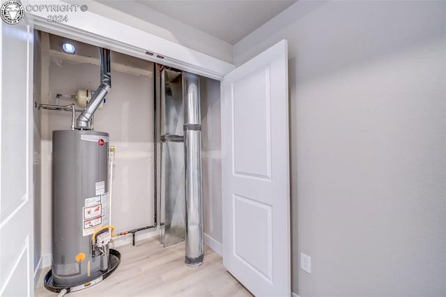 utility room with gas water heater