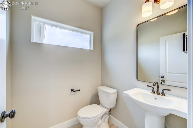 bathroom with sink and toilet