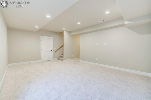 basement with light colored carpet