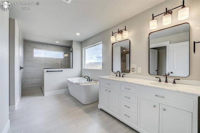 bathroom featuring vanity, tile patterned floors, and plus walk in shower