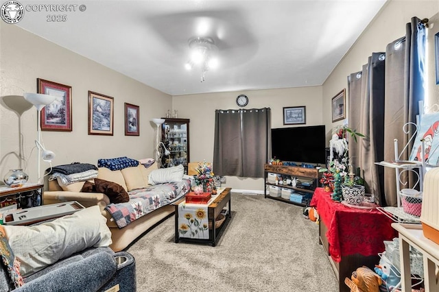 living room with ceiling fan and carpet floors