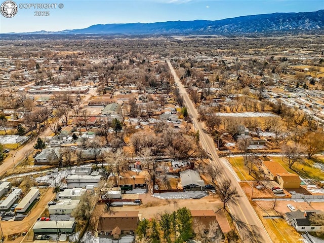 birds eye view of property featuring a mountain view