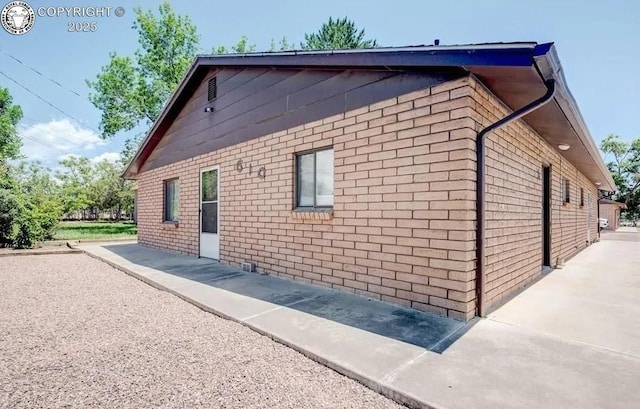 view of home's exterior with a patio