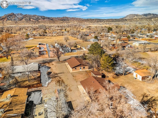 birds eye view of property featuring a mountain view