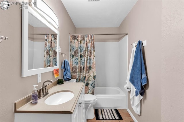 full bathroom featuring tile patterned flooring, vanity, toilet, and shower / bathtub combination with curtain