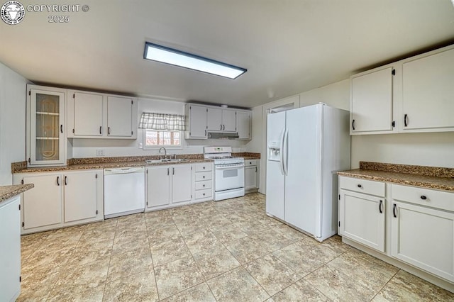 kitchen with white cabinetry, sink, and white appliances