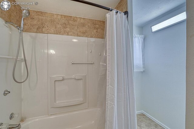 bathroom featuring shower / bathtub combination with curtain