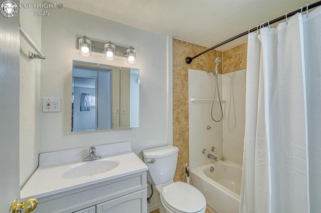 full bathroom with vanity, shower / tub combo, and toilet