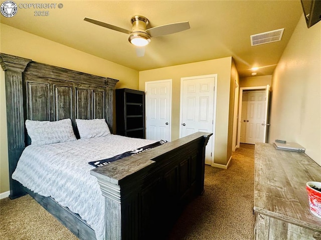 248 Indian Hills Rd, Florence, CO 81226 - bedroom with baseboards, a ceiling fan, visible vents, multiple closets, and dark carpet