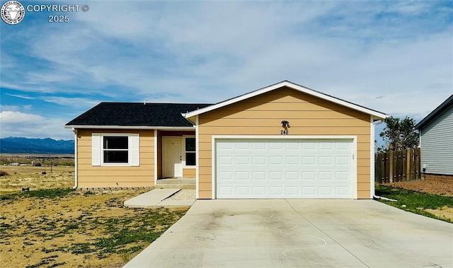 248 Indian Hills Rd, Florence, CO 81226 - single story home with a mountain view, driveway, a garage, and fence